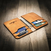 Western vertical wallet in saddle tan leather, handmade in the USA, with multiple card slots and cash pocket.
