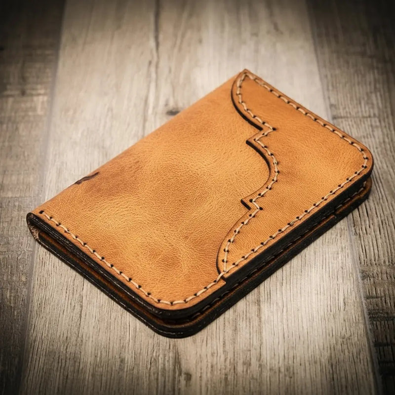 Saddle tan leather wallet, western vertical style, handmade in Texas by Bull Sheath Leather.
